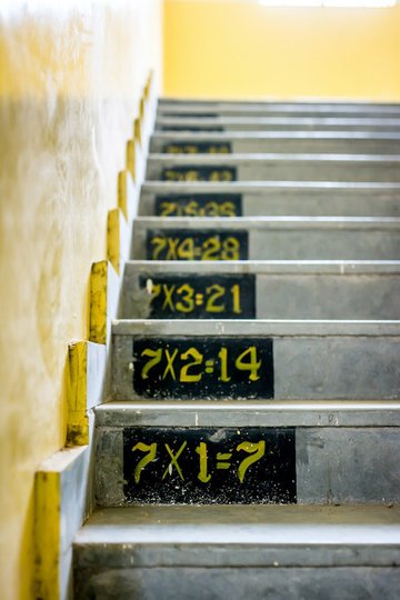 Photo of a staircase where the 101 with 7 is written on the steps.